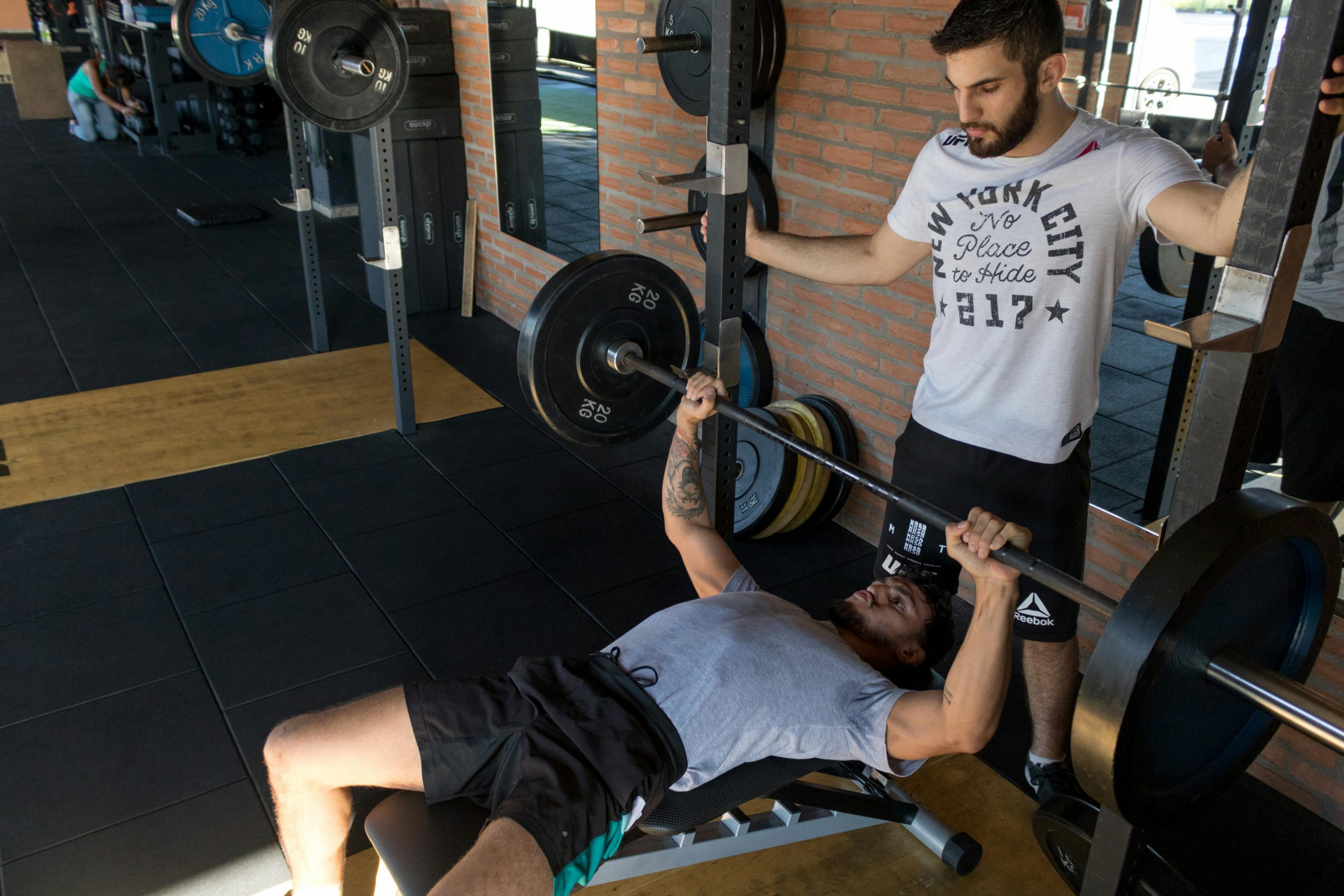 personal trainer training a client
