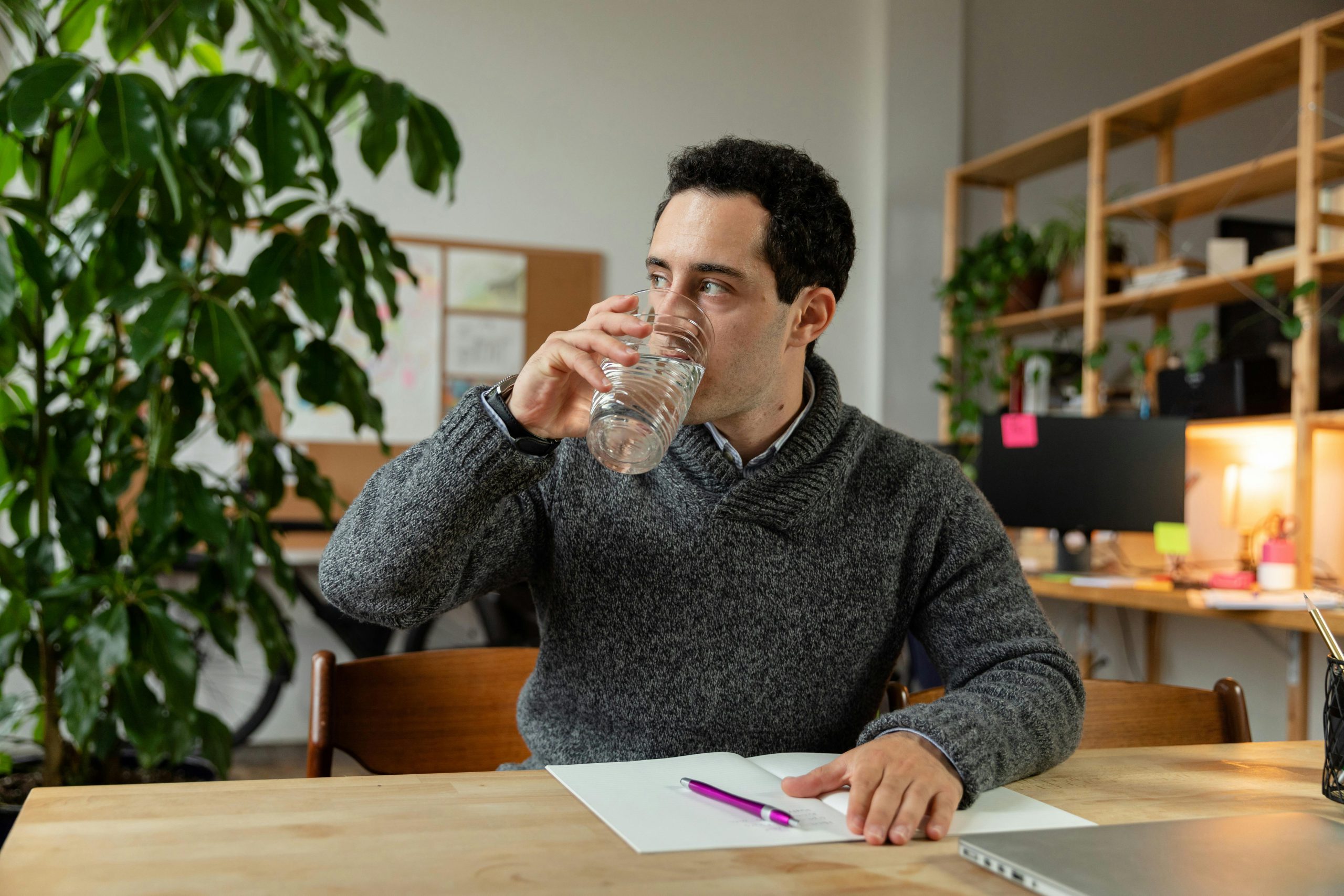 Alt tag: A picture of man drinking water in the office 